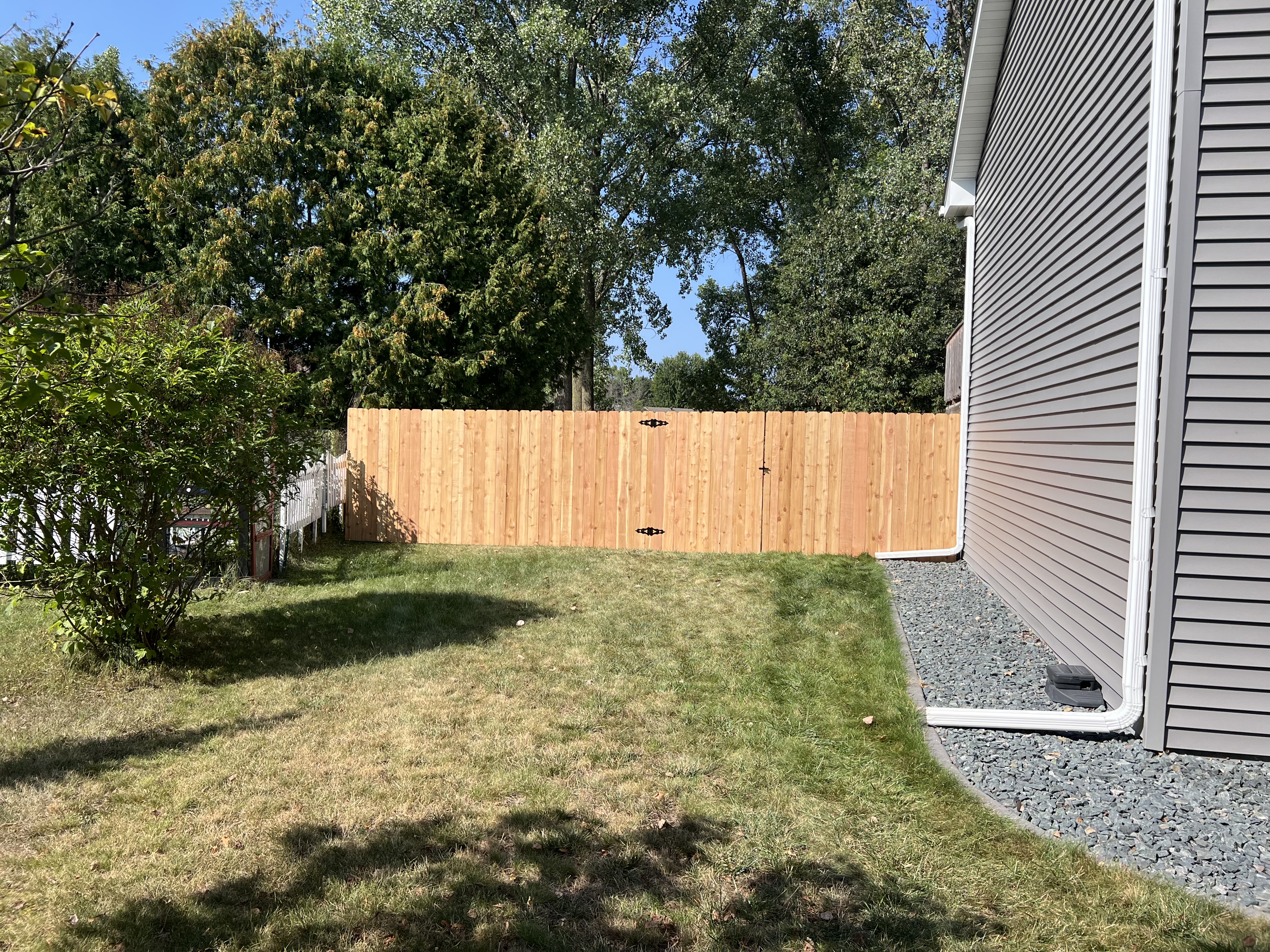 Installing 500 Feet of Custom Cedar Privacy Fencing in Eau Claire, WI
