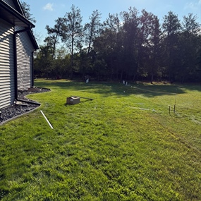 Backyard before vinyl privacy fence installation in Chippewa Falls, WI