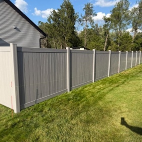Magnolia smooth grain vinyl privacy fence installation in Chippewa Falls, WI